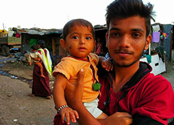 image of D Y Patil student holding a child 